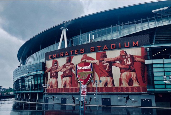 Arsenal Emirates Stadium entrance with a big screen